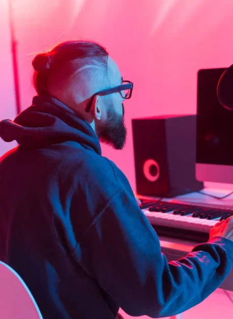 Musician and making music concept - Male sound producer working in recording studio. Musician and making music concept - Male sound producer working in recording studio