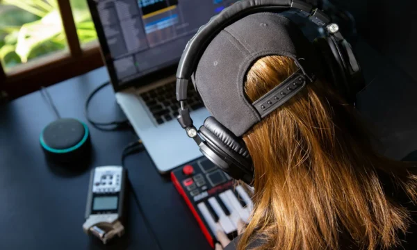 Close up of a female music producer with headphones in her home Close up of a female music producer with headphones in her home